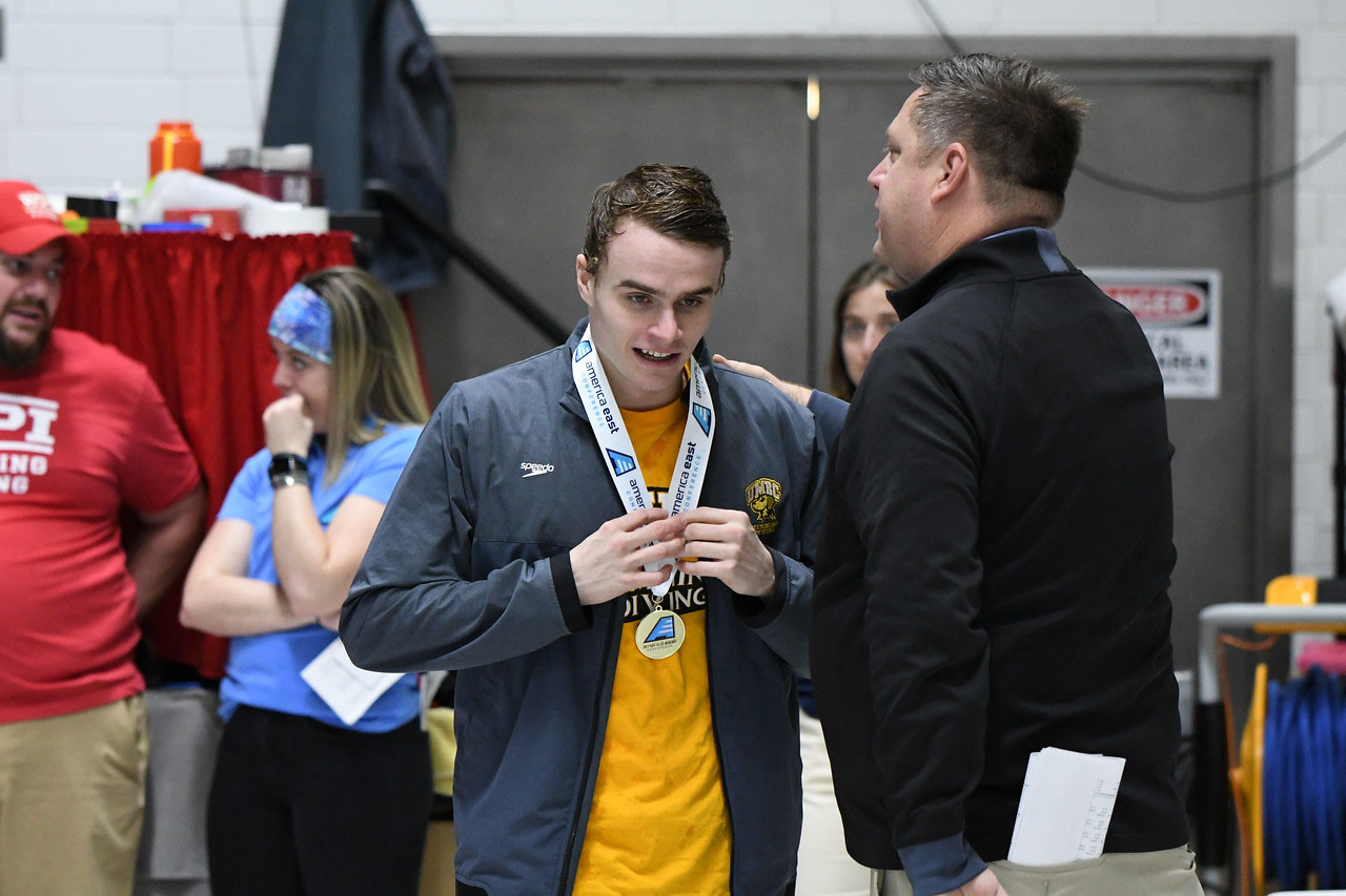Alexander Gliese medals during day two of America East competition. Photo courtesy of Colleen Hummel. 